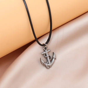 Men's stainless steel anchor pendant necklace on black wax cord over silk fabric
