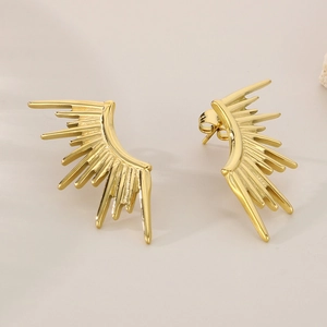 Detail view of gold 18k plated titanium steel earrings with irregular sunburst design