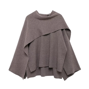 Detailed view of women's taupe knit cape coat with loose batwing sleeves and soft texture