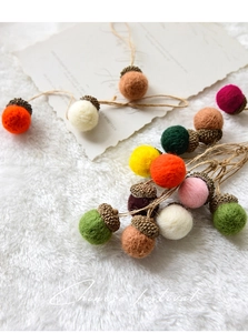Handmade wool felt acorns with natural caps and jute twine for Christmas tree decor