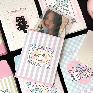 Flat lay of colorful cartoon photo card sleeves with cute puppy and cake patterns