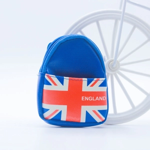 Detailed close-up of a mini backpack keychain with England flag print and metal zipper