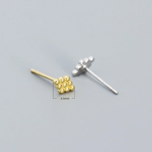 Macro view of geometric 9-bead square earrings in gold and silver, 6.5mm size
