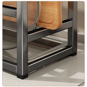 Detail of kitchen rack featuring non-slip feet, metal frame and drainage tray