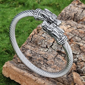 Vintage silver viking wolf head open cuff bracelet with twisted design on mossy bark