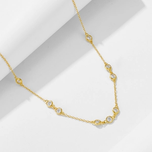 Classic 925 sterling silver gold-plated necklace with circular bezel-set zircons