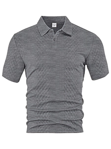 Macro detail of dark grey polo shirt showing 3D diamond jacquard texture and knit fabric