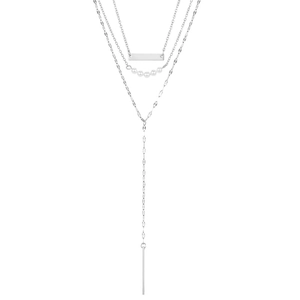 Macro shot of silver layered stainless steel necklace with bar pendants and small pearls