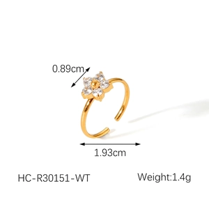 Detail view of gold flower ring with zircon inlay showing dimensions 0.89cm and 1.4g weight