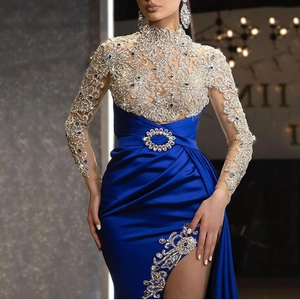 Royal blue evening gown with silver floral embroidery, high neck, and side slit