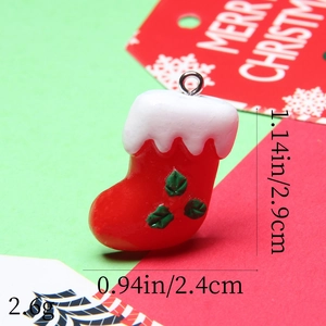 Macro view of a red resin Christmas stocking pendant with silver loop and dimensions