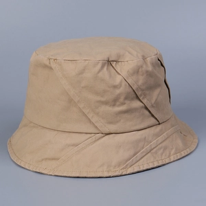 Detailed view of khaki cotton bucket hat featuring unique diagonal cross stitching texture