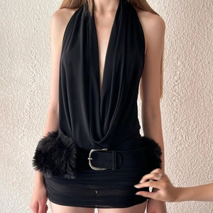 Detail of black plunge neck halter dress featuring wide leather belt with silver buckle