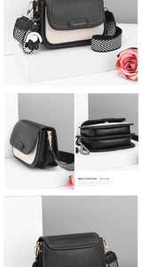 Detailed view of color-block crossbody bag with accordion layers and striped strap
