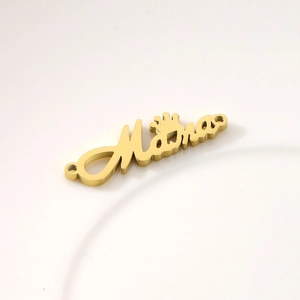 Detailed macro view of golden Mama crown connector for DIY jewelry making crafts