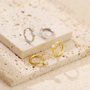 Detail view of s925 silver hoop earrings with opal inlay in gold and silver finish