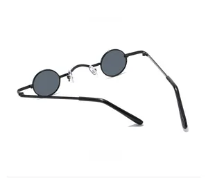 Retro round metal sunglasses featuring slim black frames and dark grey lenses in a 45-degree side view