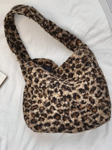 Chic leopard print faux shearling hobo bag with a spacious interior and soft plush texture