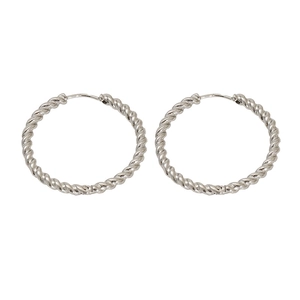 Macro detail of silver twisted rope textured stainless steel hoop earrings with high polish