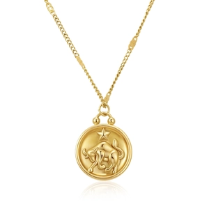 Detailed view of Taurus zodiac embossed gold pendant on a delicate stainless steel chain