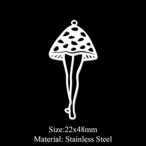 Macro shot of surreal stainless steel mushroom pendant with human legs, 22x48mm size