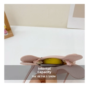 Internal capacity detail of the pink rabbit crossbody bag showing storage space