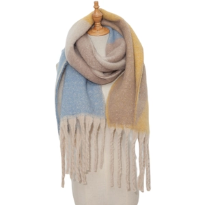 Detailed texture of thick color-block mohair scarf with chunky fringe and tassels
