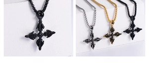 Detailed view of Vajra cross pendant in black, gold, and silver stainless steel
