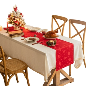 Christmas table runner with red jacquard tree pattern and cream lace tablecloth