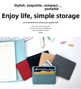 Close-up of slim multi-slot faux leather card holders in various colors on office desk