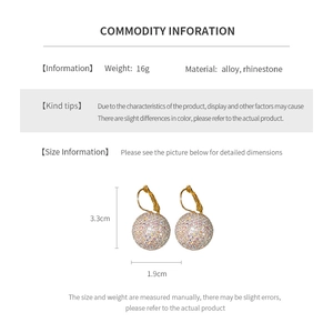 Detailed spec sheet showing 3.3cm gold drop earrings with crystal spheres and 16g weight