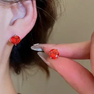 Elegant sparkling red zircon geometric round stud earrings with four-prong silver setting
