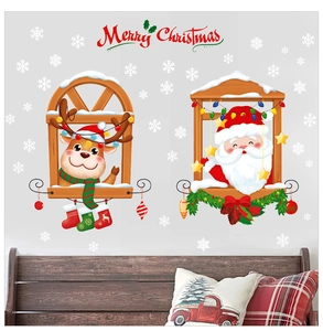 Detailed view of Santa and reindeer Christmas window stickers on a light gray wall scene