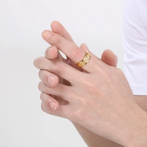 Men's titanium steel gold ring with textured band and sparkling center cubic zirconia