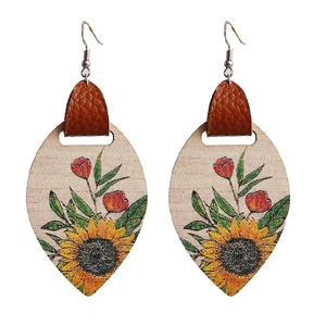 Bohemian wood sunflower earrings with leather detail in teardrop shape on white background