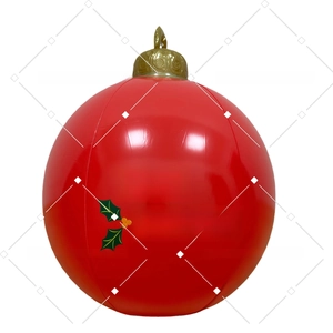 Detail view of red inflatable Christmas ball with white Merry Christmas lettering and holly