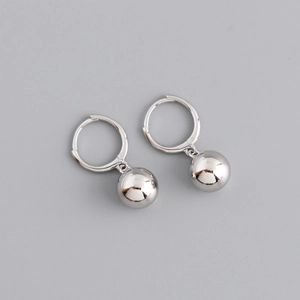 Sleek silver hoop earrings featuring polished metal spheres in a minimalist geometric style