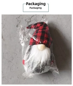 Christmas gnome plush in red and black buffalo plaid hat inside clear polybag packaging