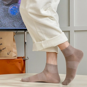 Brown mesh cotton ankle socks for men featuring ribbed texture and breathable knit fabric