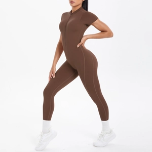 Side view of dark coffee short sleeve yoga jumpsuit with sleek front zipper detail