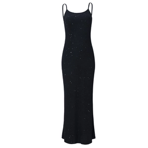 Detail of slim fit black glitter maxi dress with starry silver sparkles on fabric
