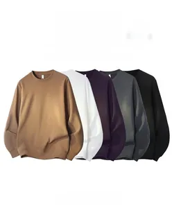 Detailed pile of five colorful fleece crewneck sweatshirts with ribbed cuffs and hem