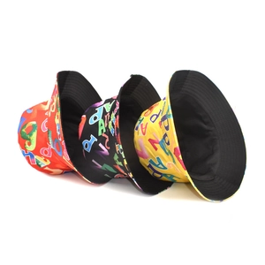 Letter print bucket hat in red black and yellow colors for outdoor sun protection