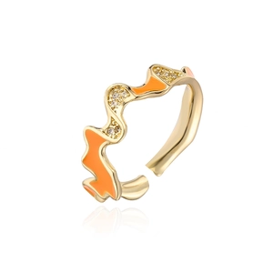 Detail view of wave-shaped 18K gold plated ring with orange enamel and cubic zirconia