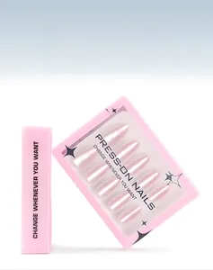 Macro detail of pearlescent pink almond press-on nails in a 30-piece box set packaging