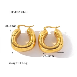 Macro view of gold-plated chunky hoop earrings with 26.8mm height and 27.3mm width