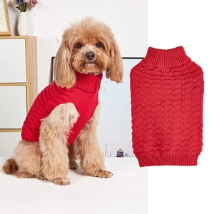 Detail of red high-collar knit pet sweater showing ribbed hem and checkered texture