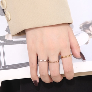 Minimalist interlocking chain rings in gold, silver, and rose gold stainless steel