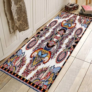 Macro detail of paisley runner rug with non-slip backing and stitched edges on wood floor