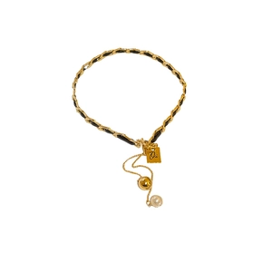 Chic gold chain necklace with black ribbon, pearl pendant and square metal tag